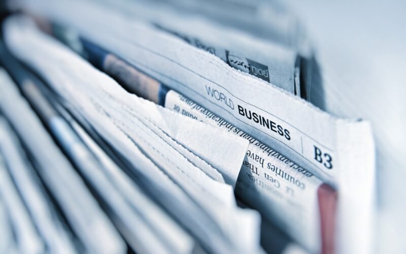 News headlines and social media feed on phone screen