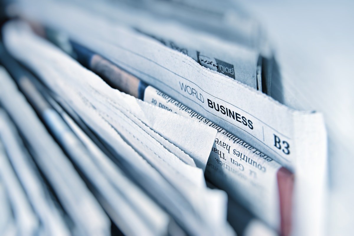 News headlines and social media feed on phone screen