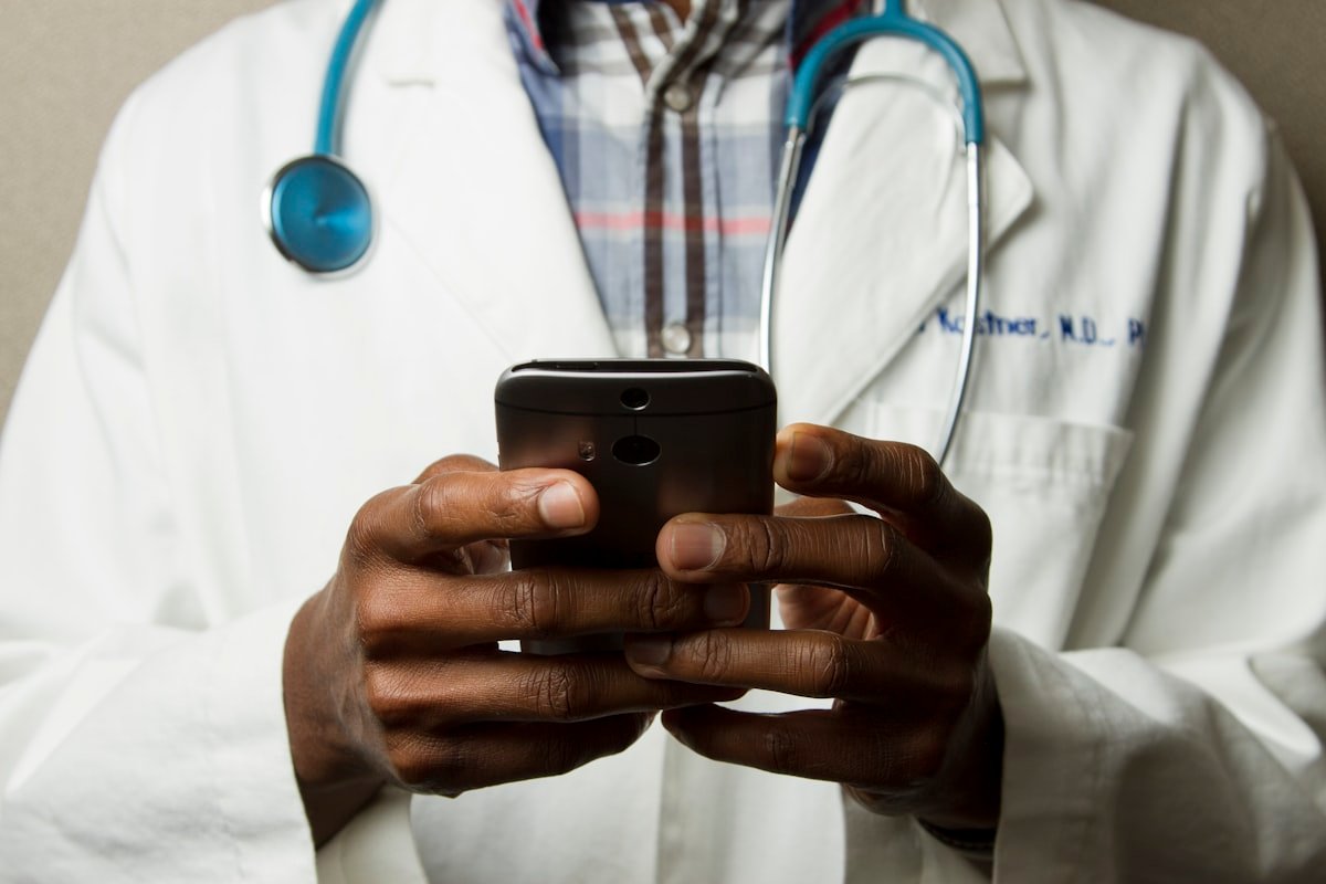 Person checking health app on smartwatch with medical data