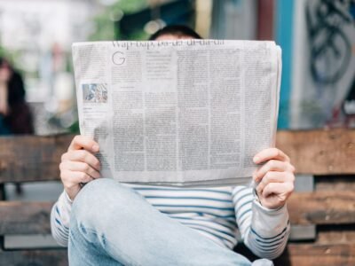 A stack of folded newspapers