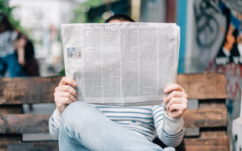 A stack of folded newspapers