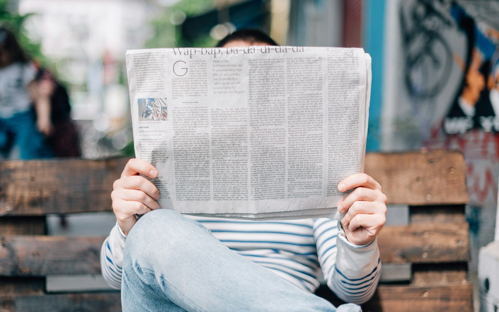 A stack of folded newspapers