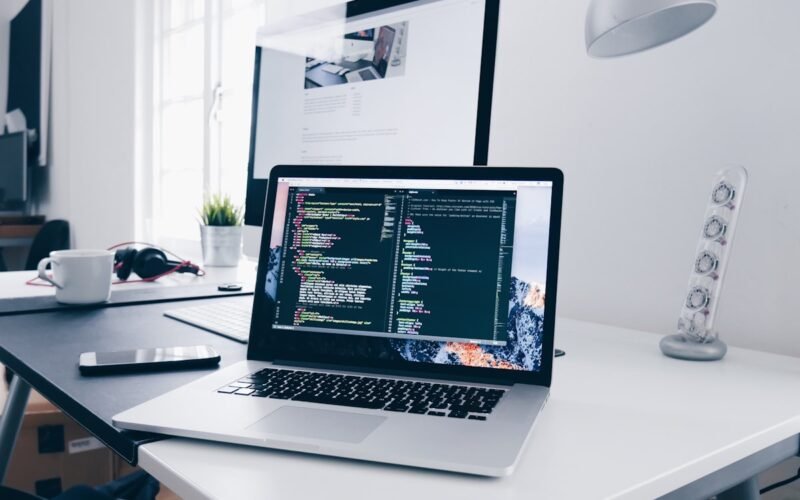 Laptop with sales charts and pipeline dashboard