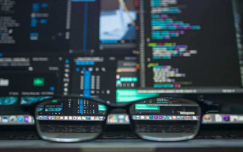 Data science workspace with code, charts, and neural network diagram