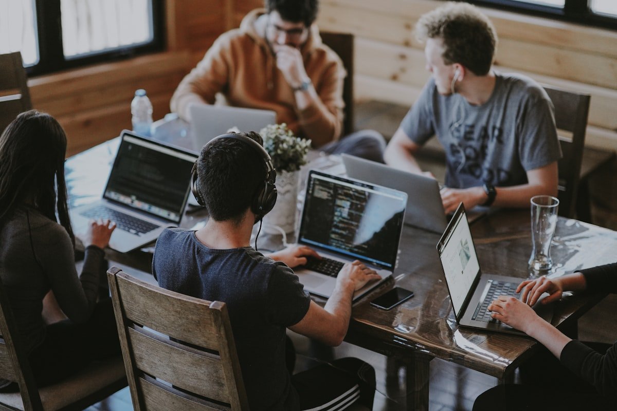Freelancer working remotely on laptop with multiple clients